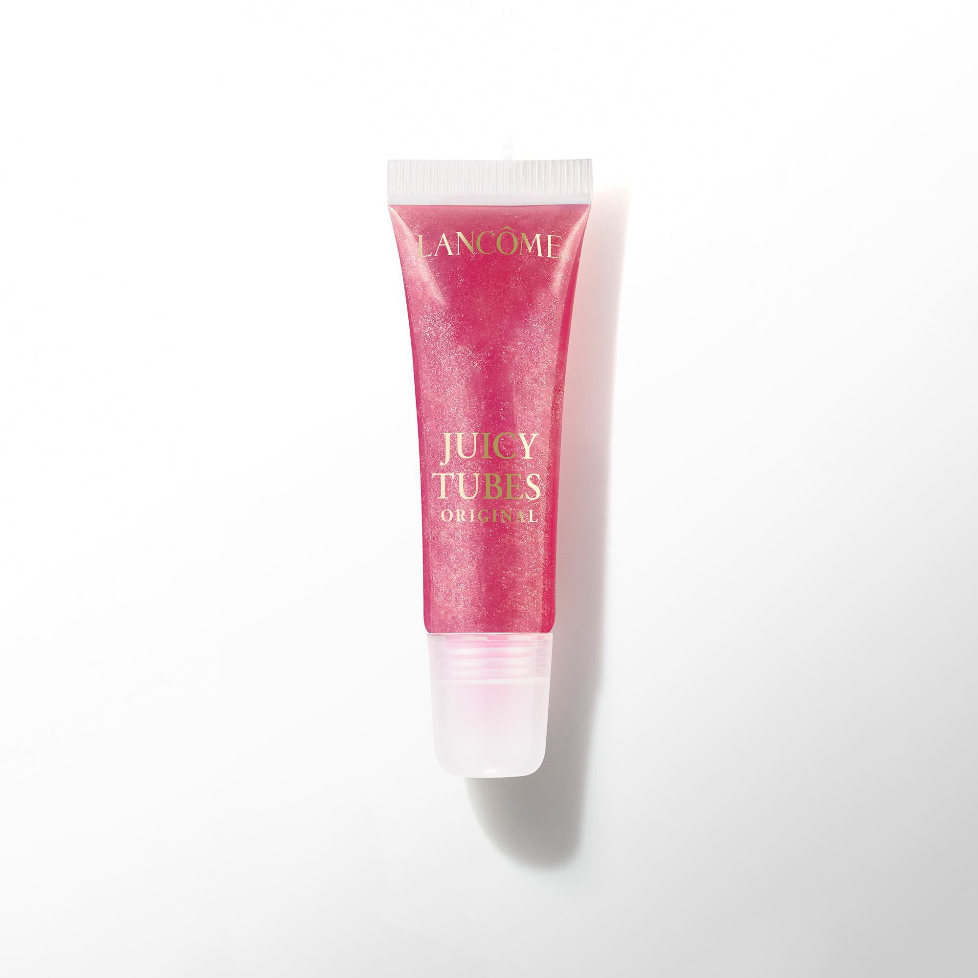 A tube of Lancome Juicy Tubes Original lip gloss in a dark berry or magenta shade.