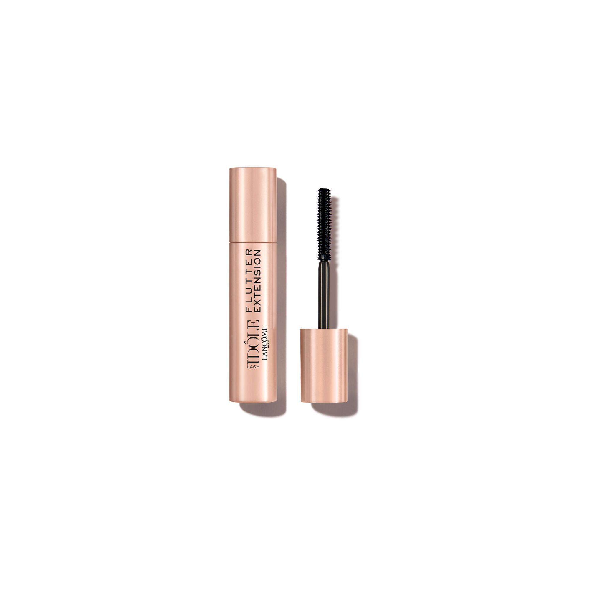 A rose gold tube of Lancome Idole Flutter Extension mascara with its wand standing alongside.