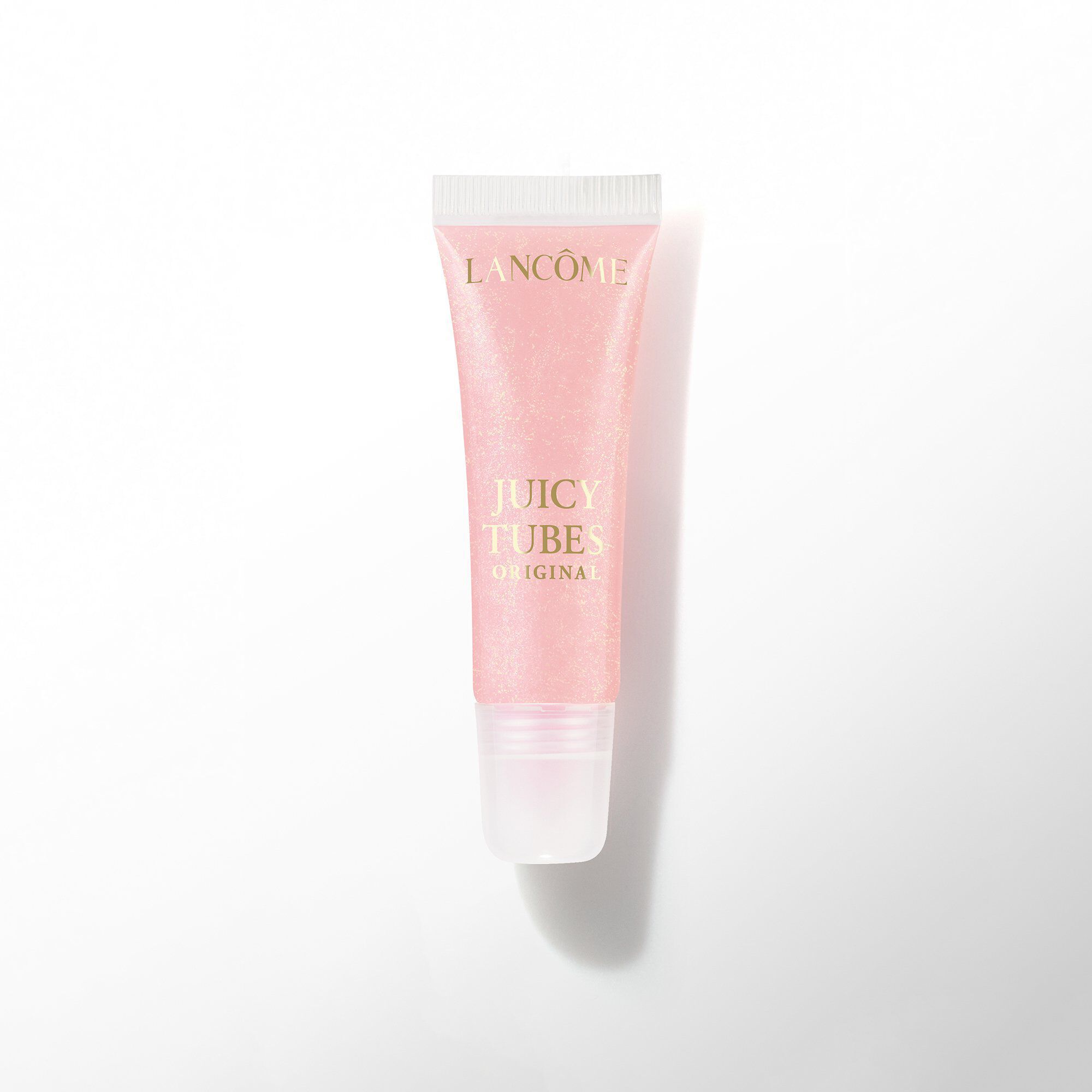 A tube of Lancome Juicy Tubes Original lip gloss in a light, pale pink shade.