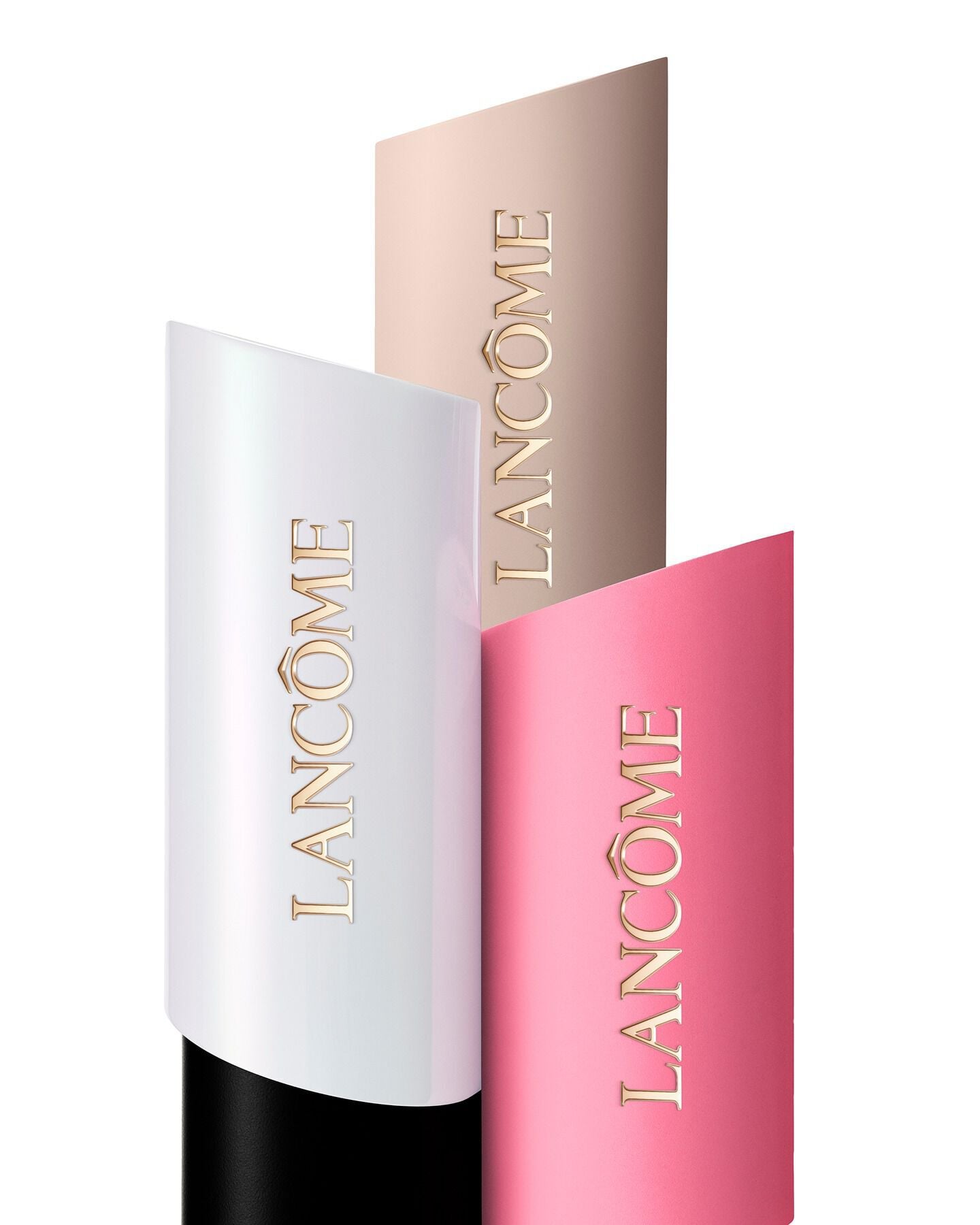 Tiered arrangement of three Lancome Teint Idole Shape Stick Foundation, Highlighter and Blush in white, beige, and pink.